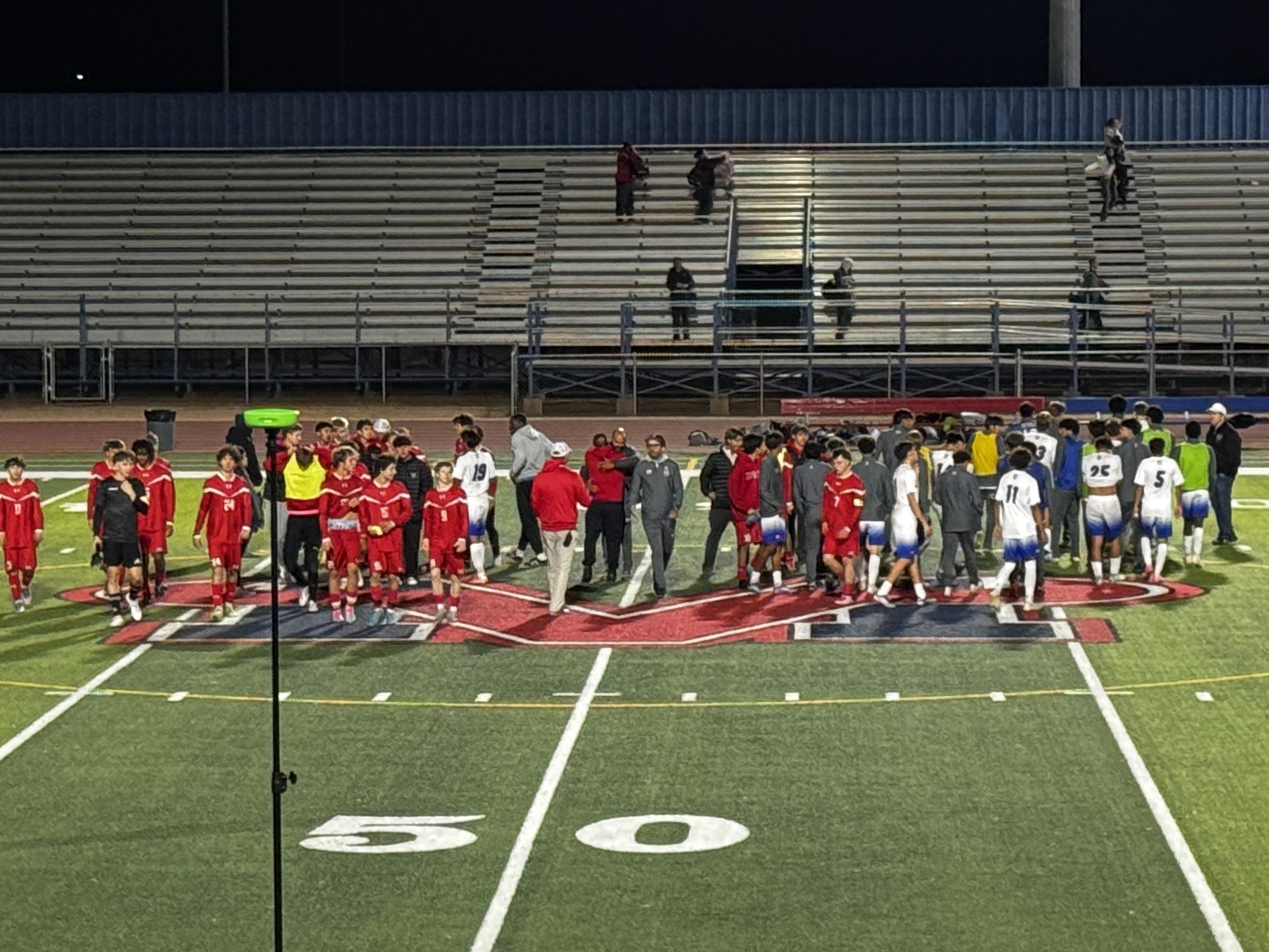 Mountain View boys soccer teams meeting at midfield