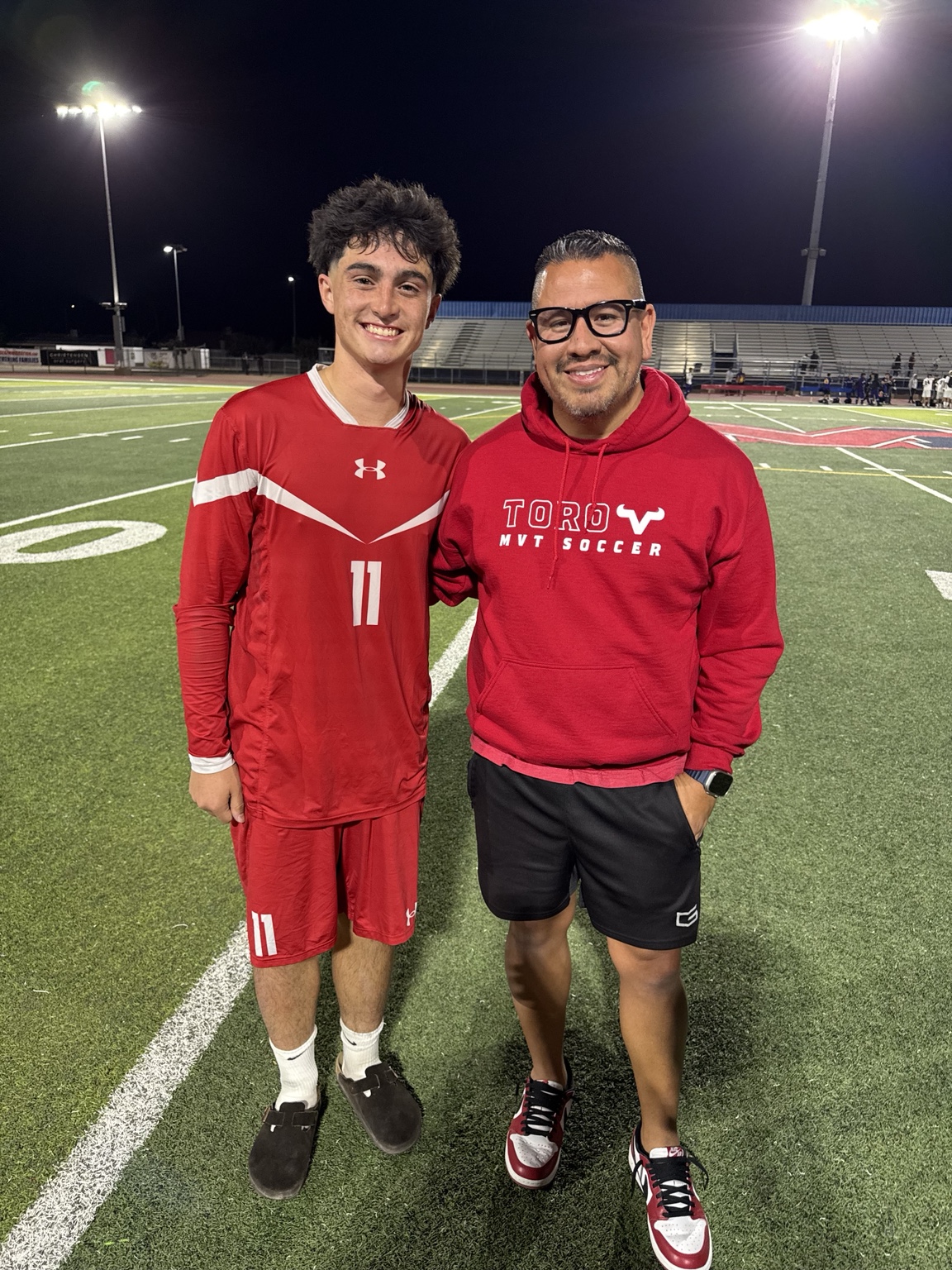 Mountain View boys soccer player with his coach