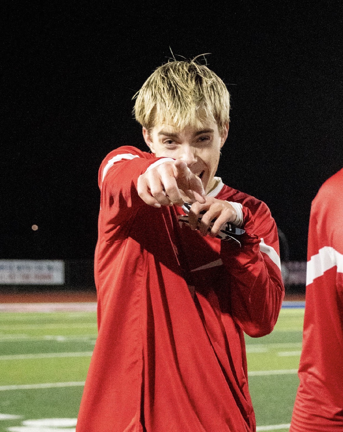 Mountain View boys soccer player celebrating under the lights