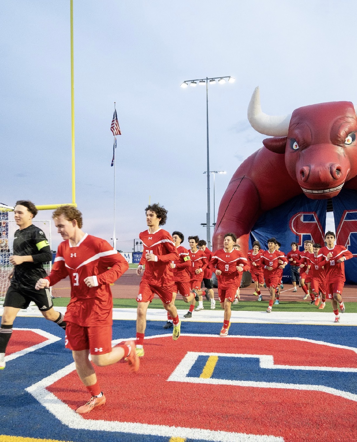 Mountain View boys soccer team entering the field through the Toro tunnel