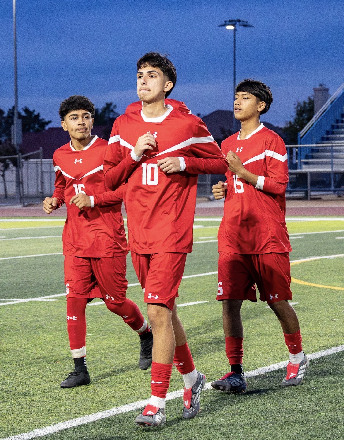Mountain View boys soccer players walking onto the field