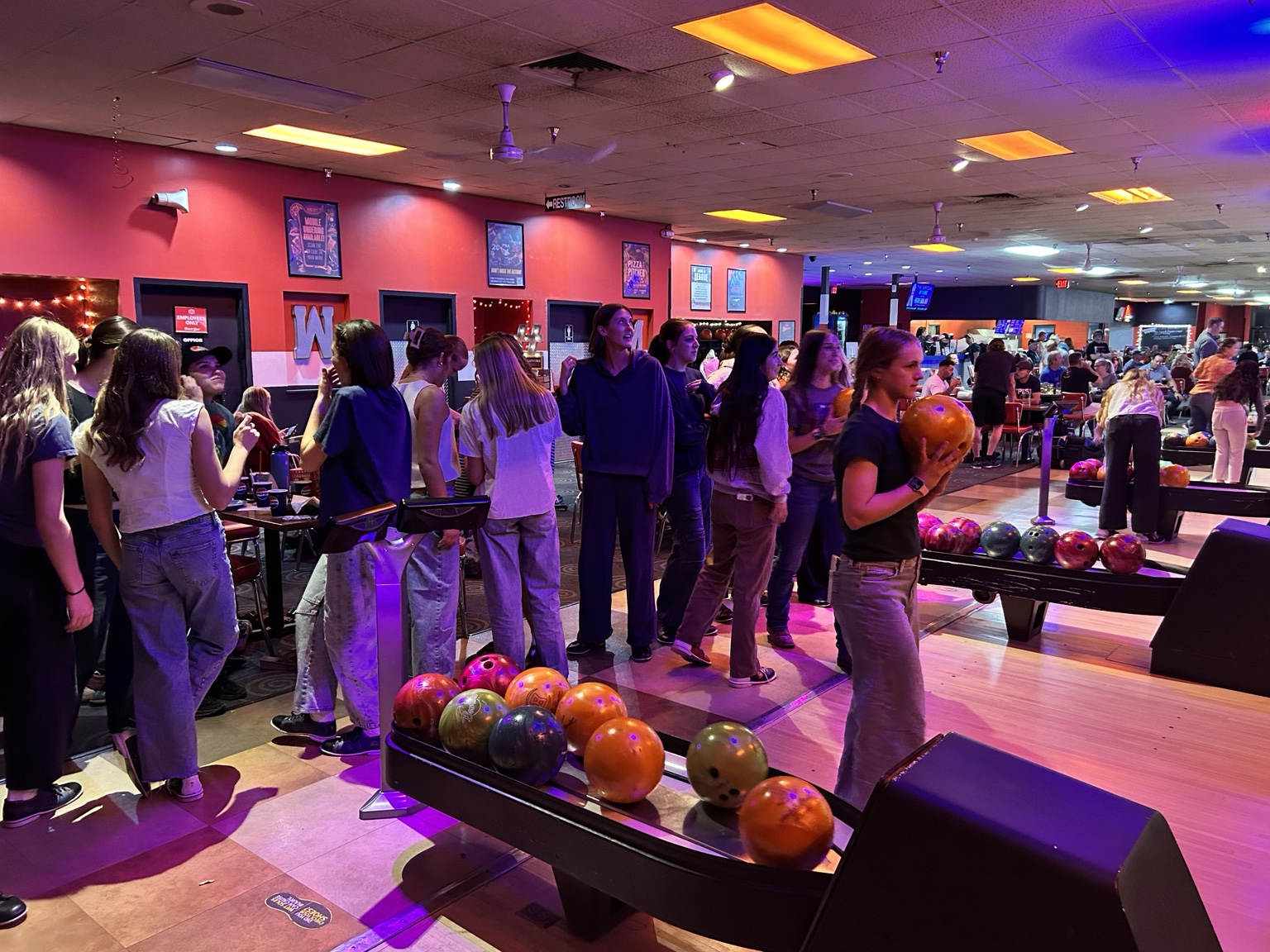 Mountain View girls soccer players together at a team bowling event