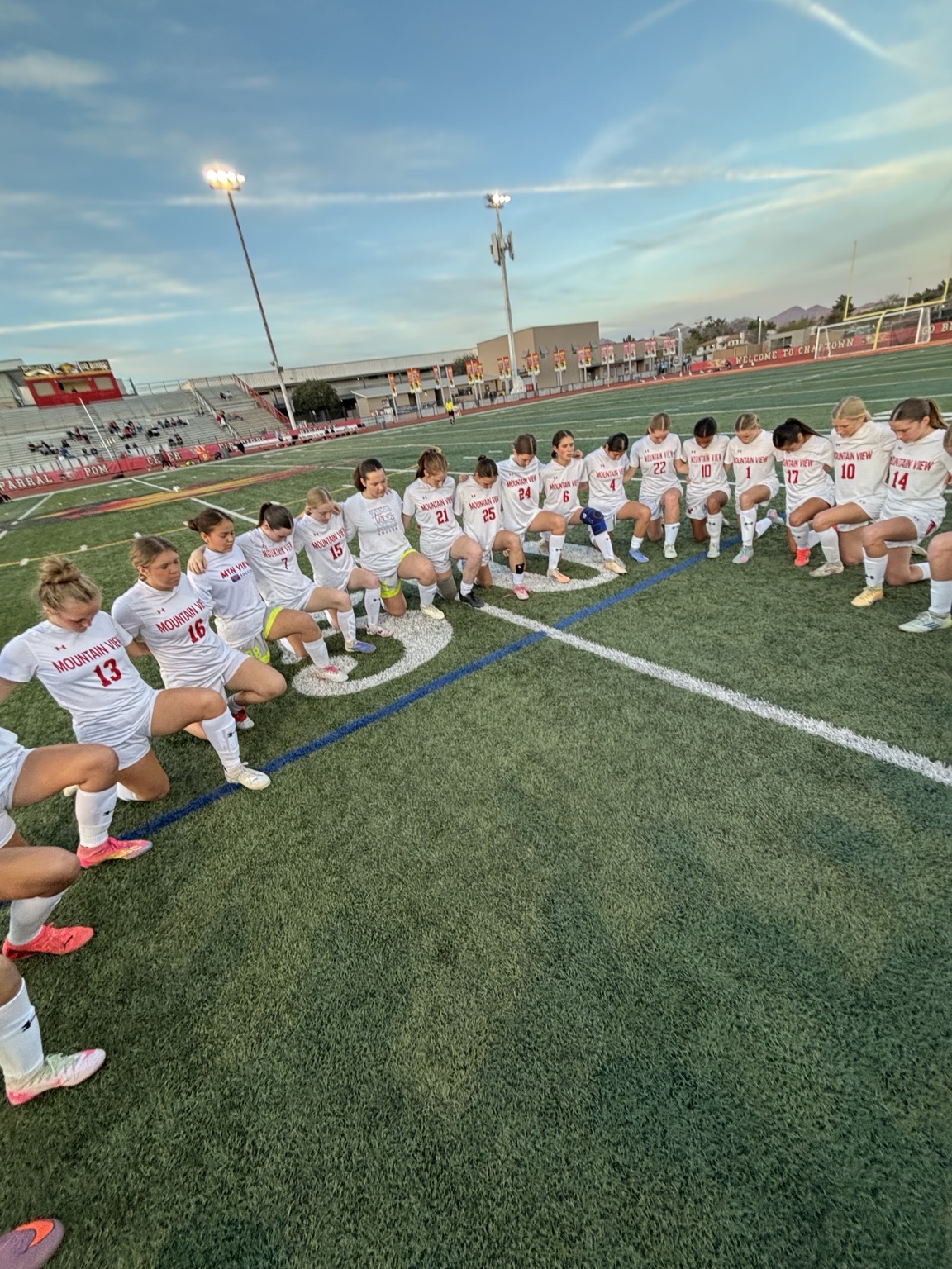 Mountain View girls soccer team in a pregame huddle