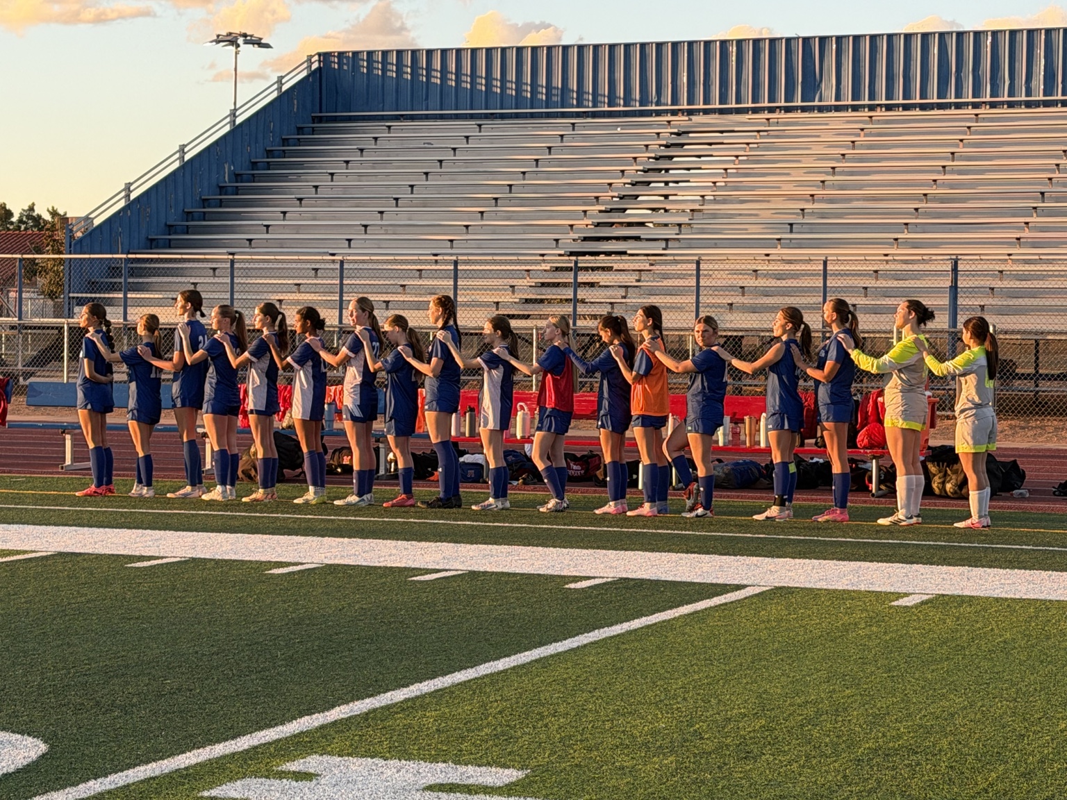 Mountain View girls soccer team lined up at sunset