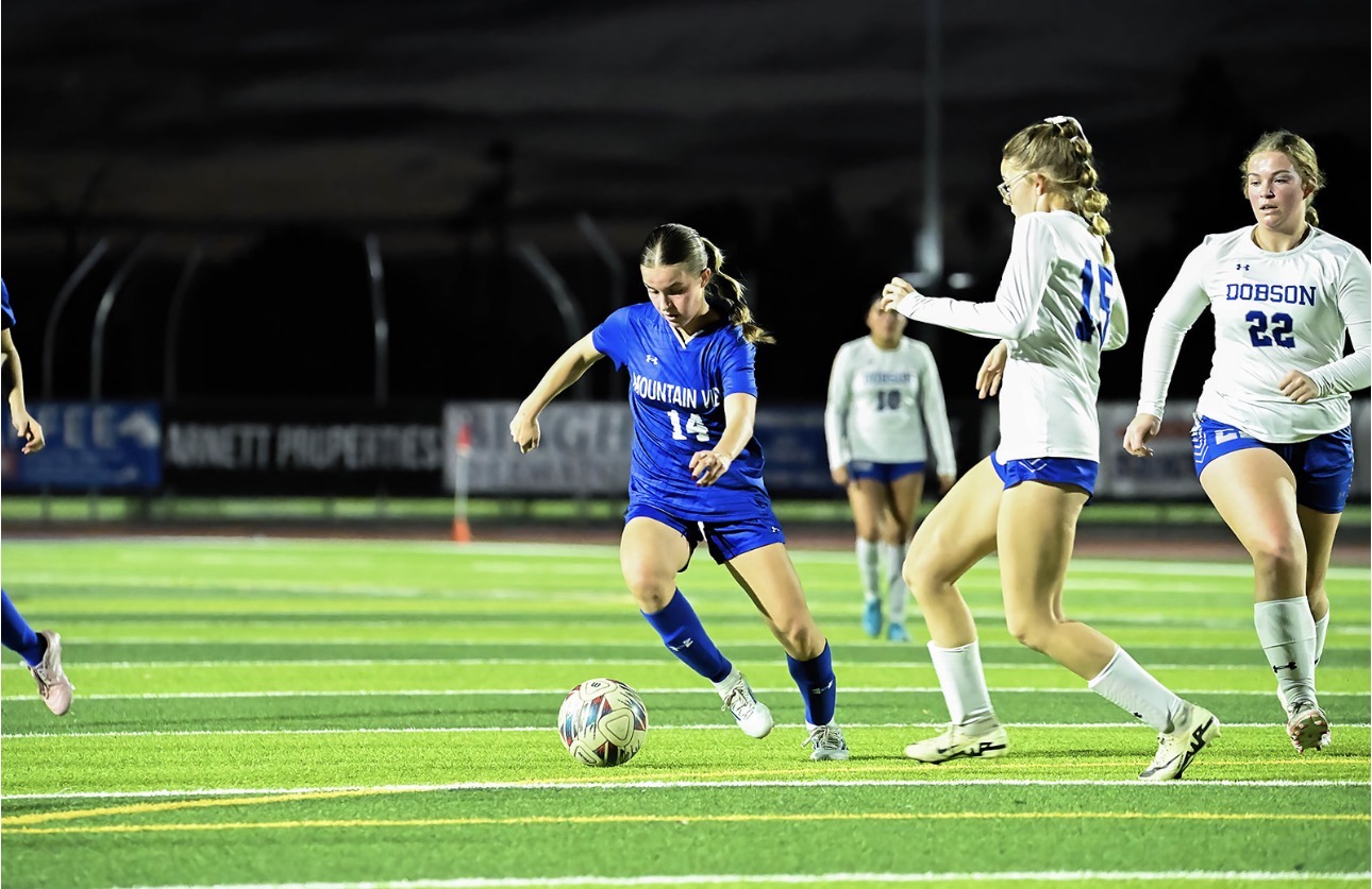 Mountain View girls soccer player driving forward with the ball