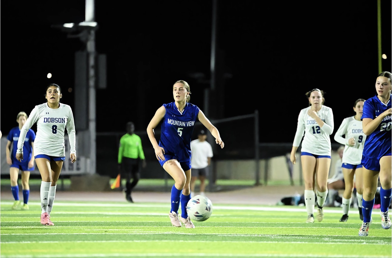 Mountain View girls soccer player advancing through midfield